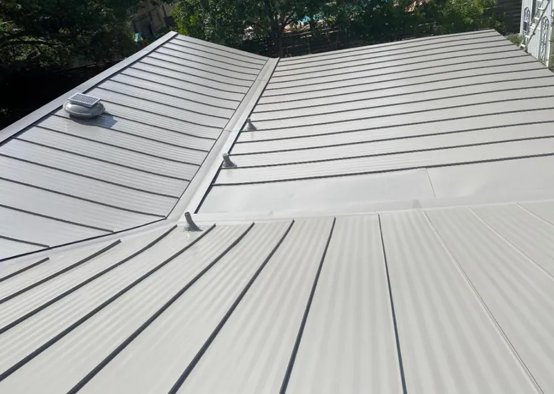 Solar attic fan installed on a metal roof for Roof Ventilation in Schuylkill